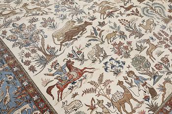 A semi-antique Ghom carpet, approx. 390 x 290 cm.