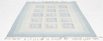 A flat weave rug, c. 240 x 163 cm.