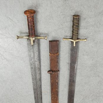 Two East African Kaskara swords- One with scabbard. 19-20th Century.