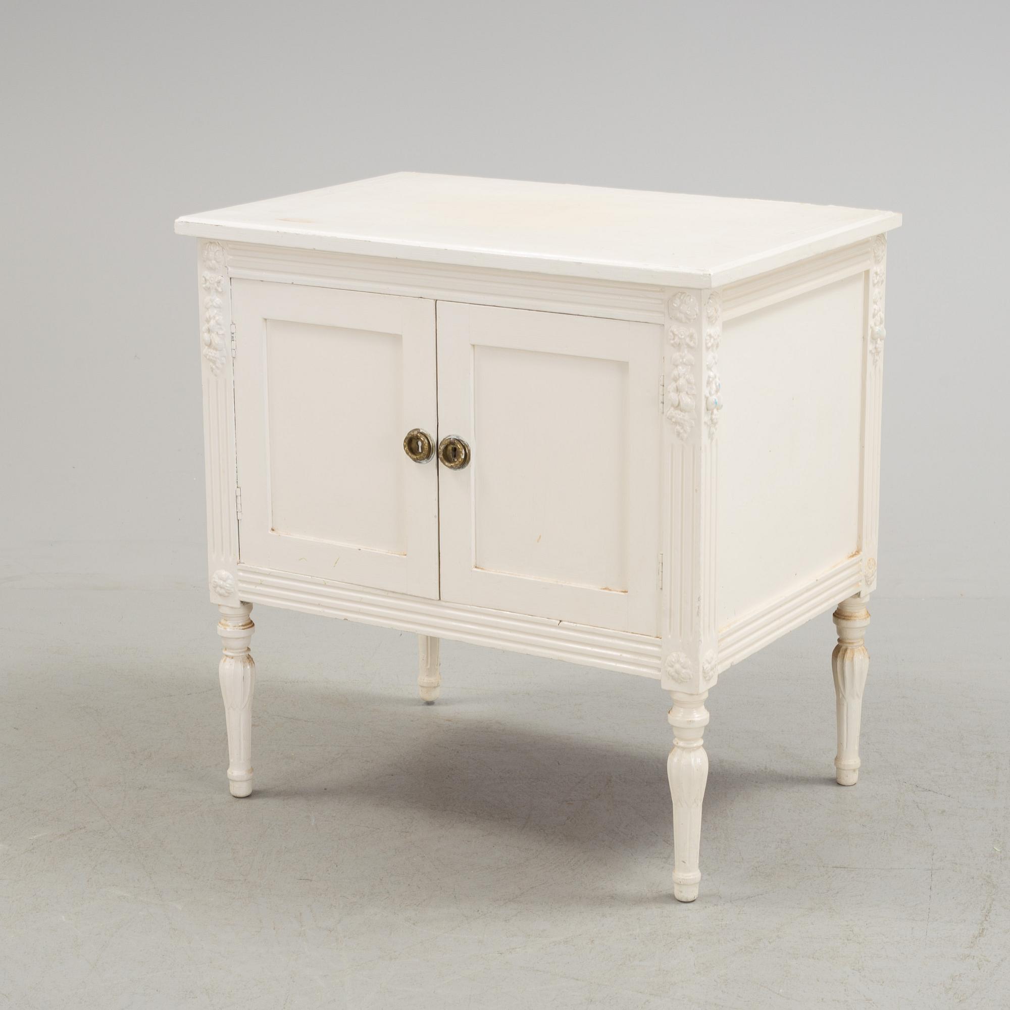 An early 20th century Gustavian style cupboard.