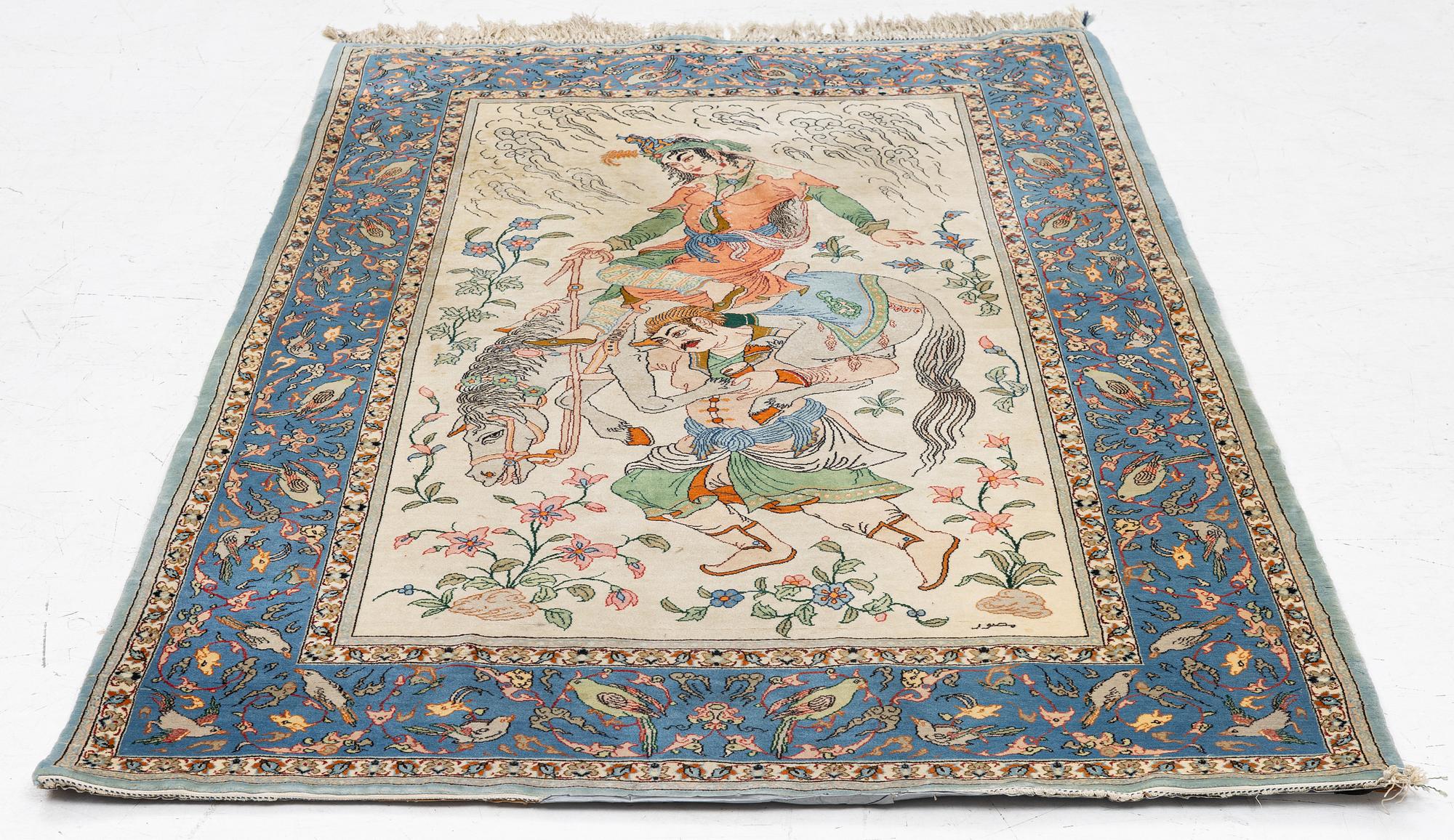 An Isfahan, figural rug, signed, c. 172 x 109 cm.