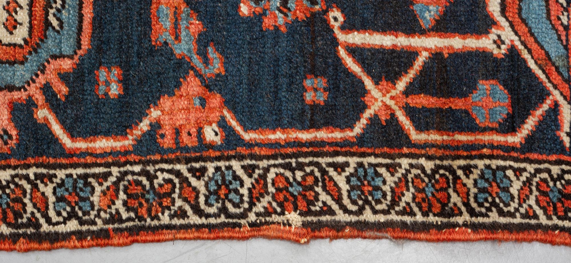 A carpet, an antique Heriz, ca 469,5-471 x 300-309,5 cm.