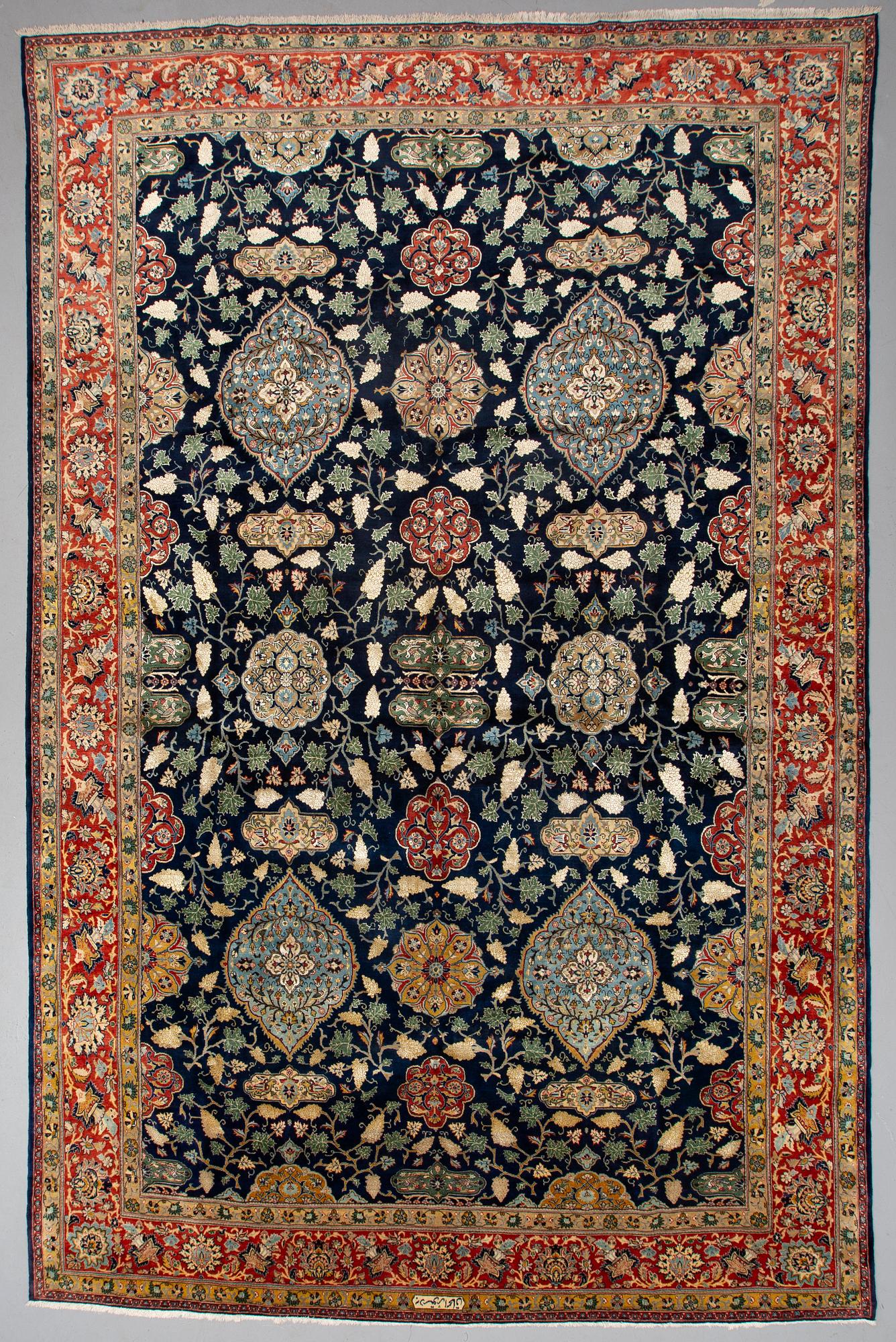 A CARPET so called Royal Kashan, part silk, signed, ca 483 x 311 cm.