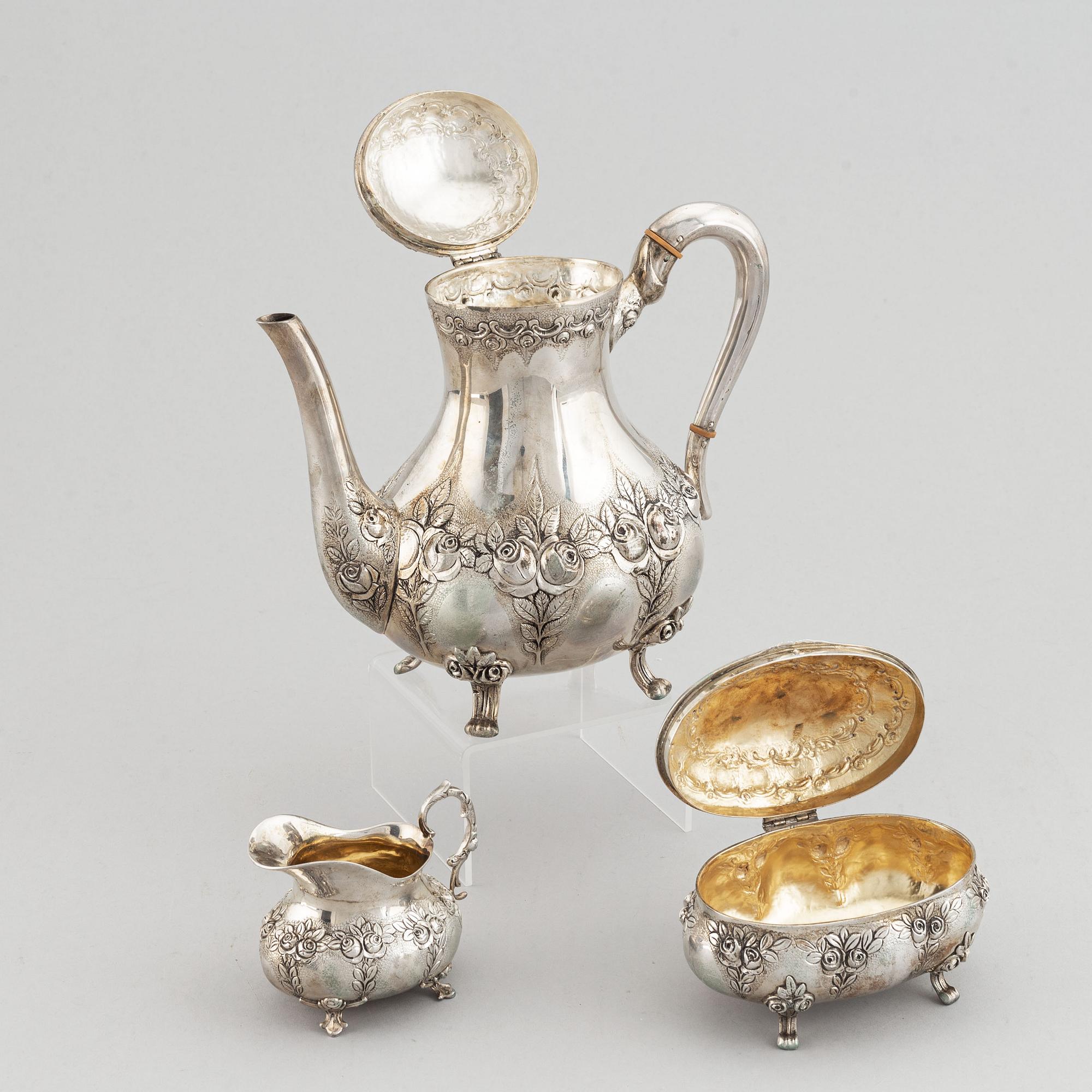 A rococo-style coffee pot, creamer and sugar bowl, swedish import mark, 20th century.