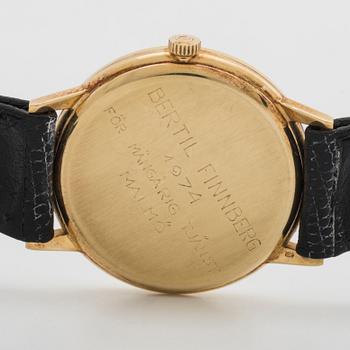 A 14 ct gold Omega Geneve wrist watch.