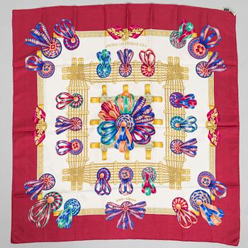 Hermès, a 'Les Rubans du Cheval' silk scarf.