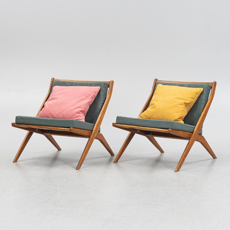 Folke Ohlsson, a pair of oak Frisco easy chairs, Nodafors, 1960s.