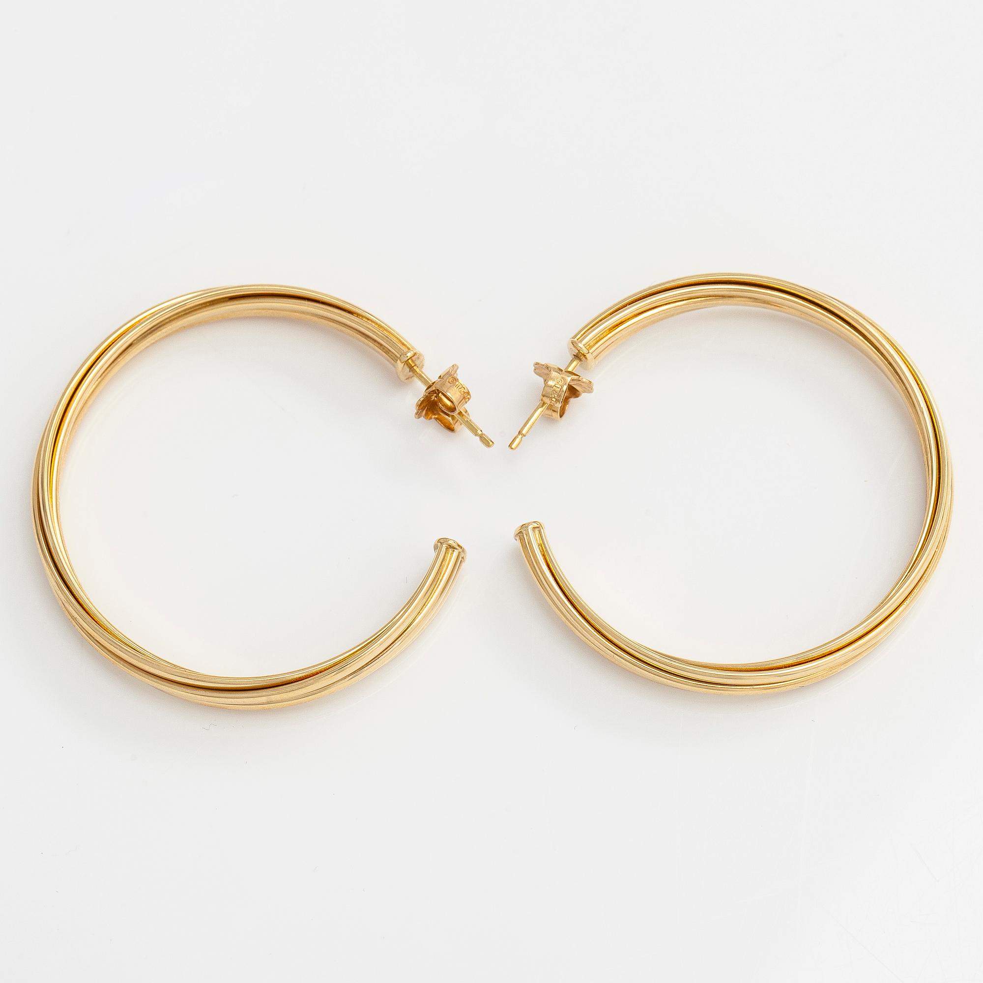 Tiffany & Co, Paloma Picasso, "Melody" hoop earrings in 18K gold.