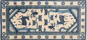 A Chinese Baotou carpet semiatnique approx 127x64 cm.