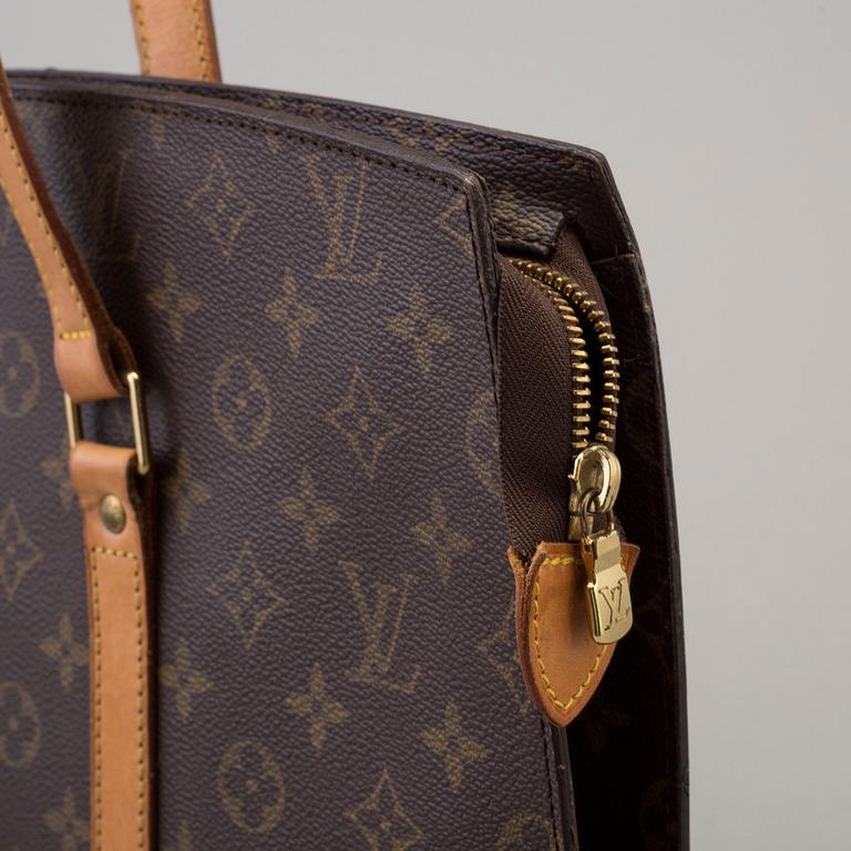 a Louis Vuitton "Babylon" bag.