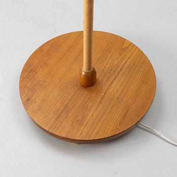 A 1940s Swedish Modern floor lamp.