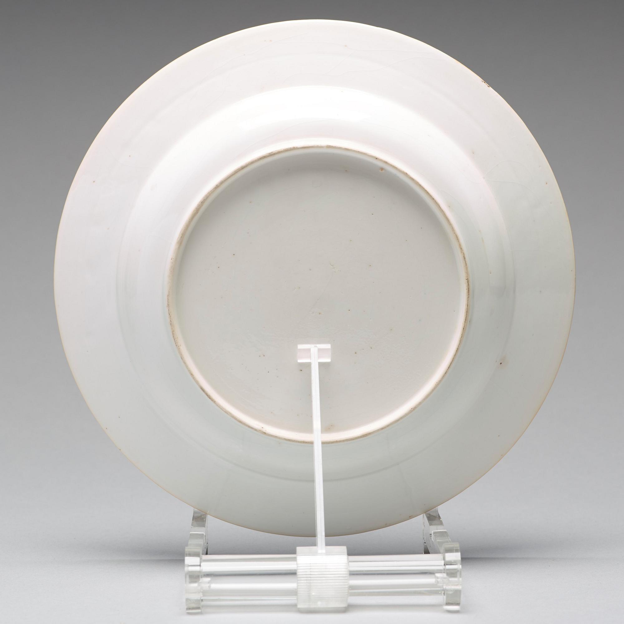 A set of eight blue and white armorial soup dishes, Qing dynasty, 18th Century.