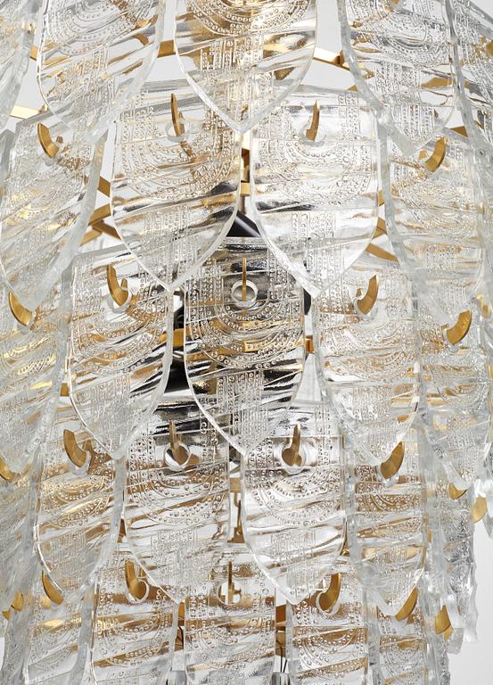 GUNNAR CYRÉN, a glass and gilt bronze chandelier, Orrefors, Sweden 1960's.