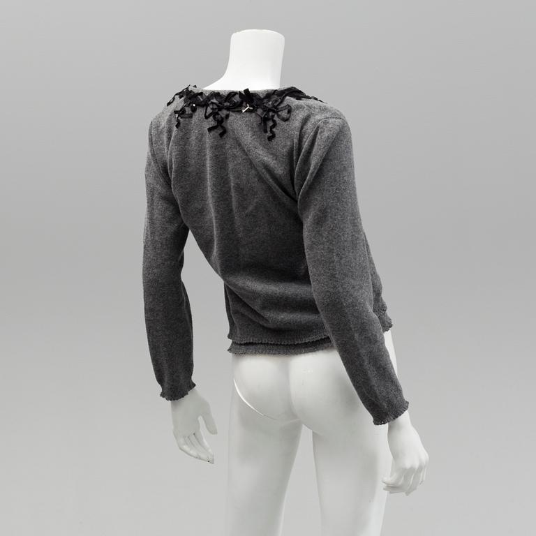 Cardigan and top by Moschino, Cheap and Chic.