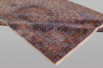 A carpet, Moud, signed, ca 385 x 268 cm.