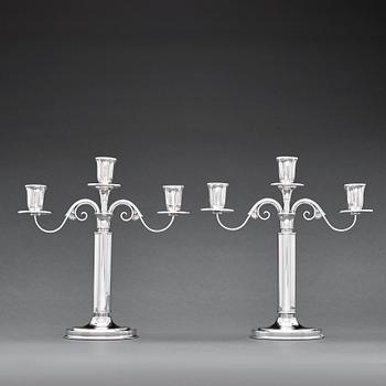 152. W.A Bolin, a pair of two branched silver candelabra, Stockholm 1935.