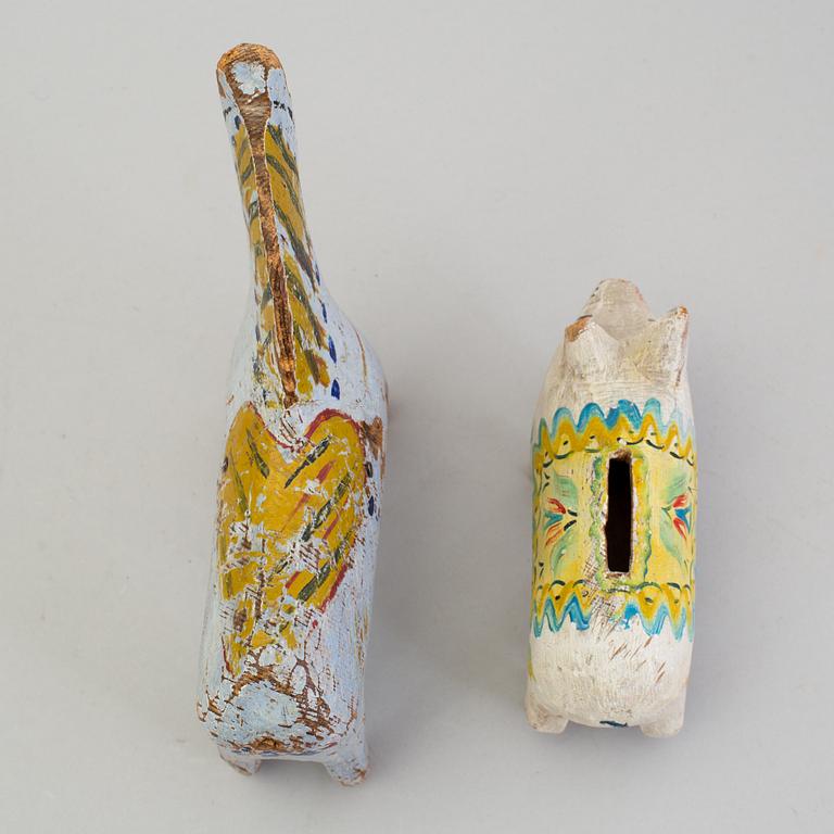A painted folk art dala horse and dala pig, first half of the 20th century.