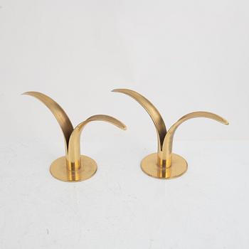 Ivar Ålenius-Björk, four brass candlesticks, Ystad Metall, mid 20th century.