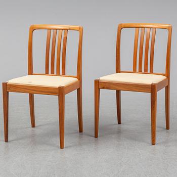 A 1950/60s teak and valnut table and four chairs.