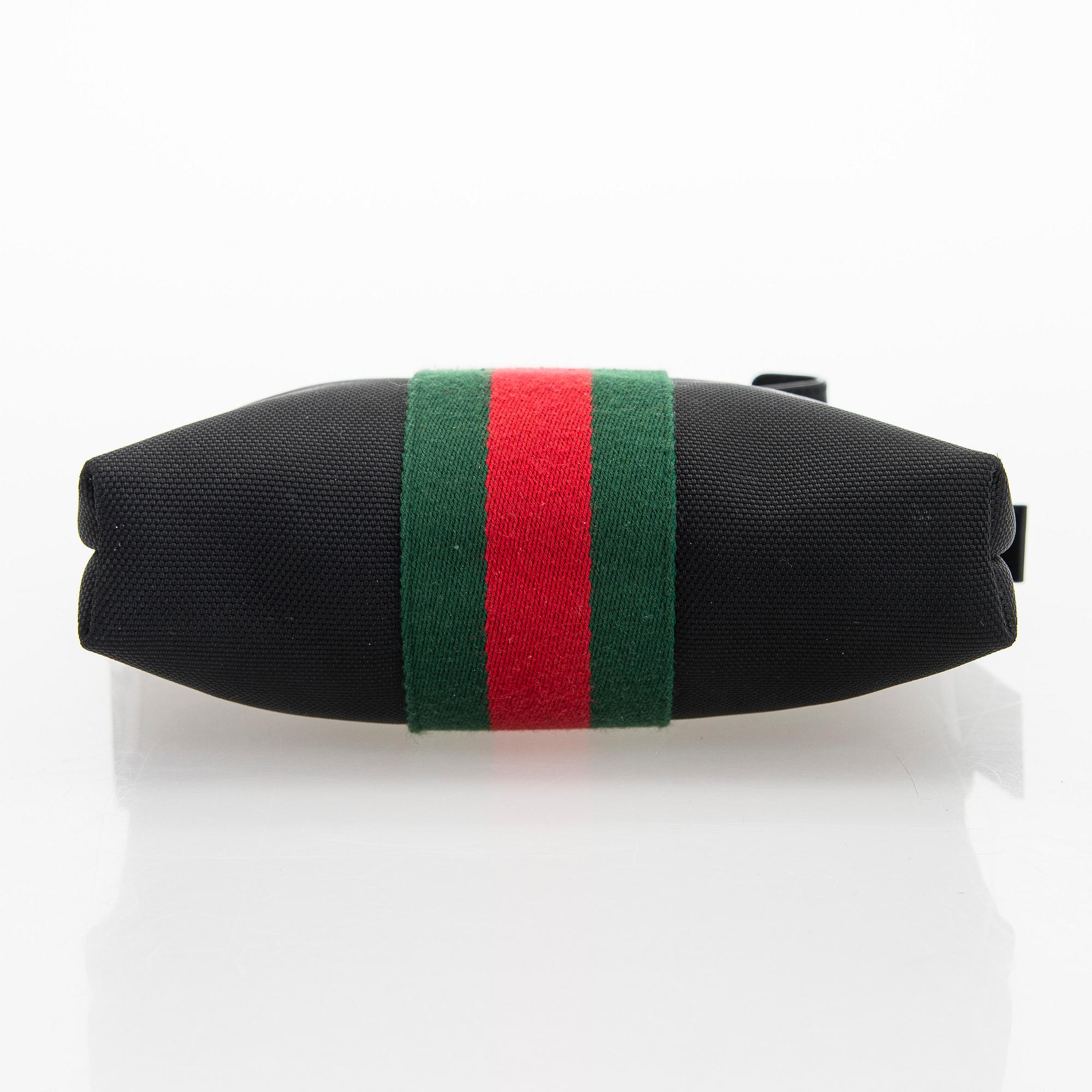 Gucci, a "Techno Canvas Web Messenger" bag.