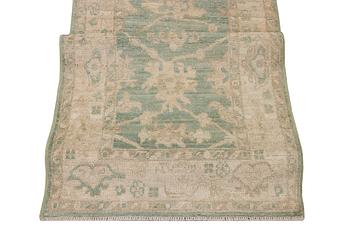 An Ushak runner carpet, c. 293 x 83 cm.