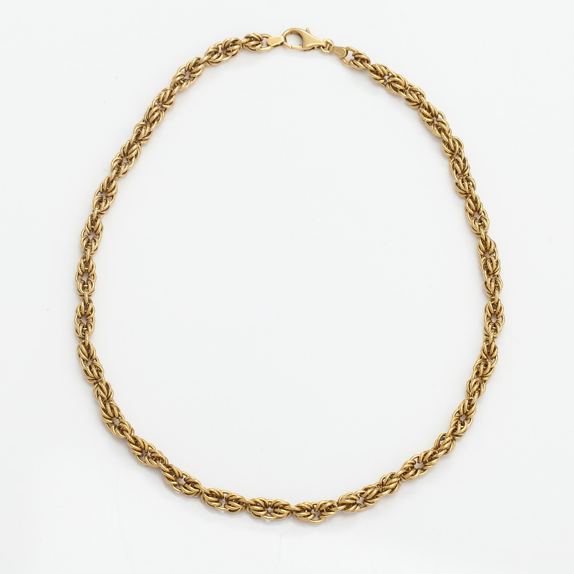 An 18K gold necklace. Unoaerre, Italy.