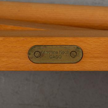 Mogens Koch, a set of four folding chairs, Kado, late 20th century.