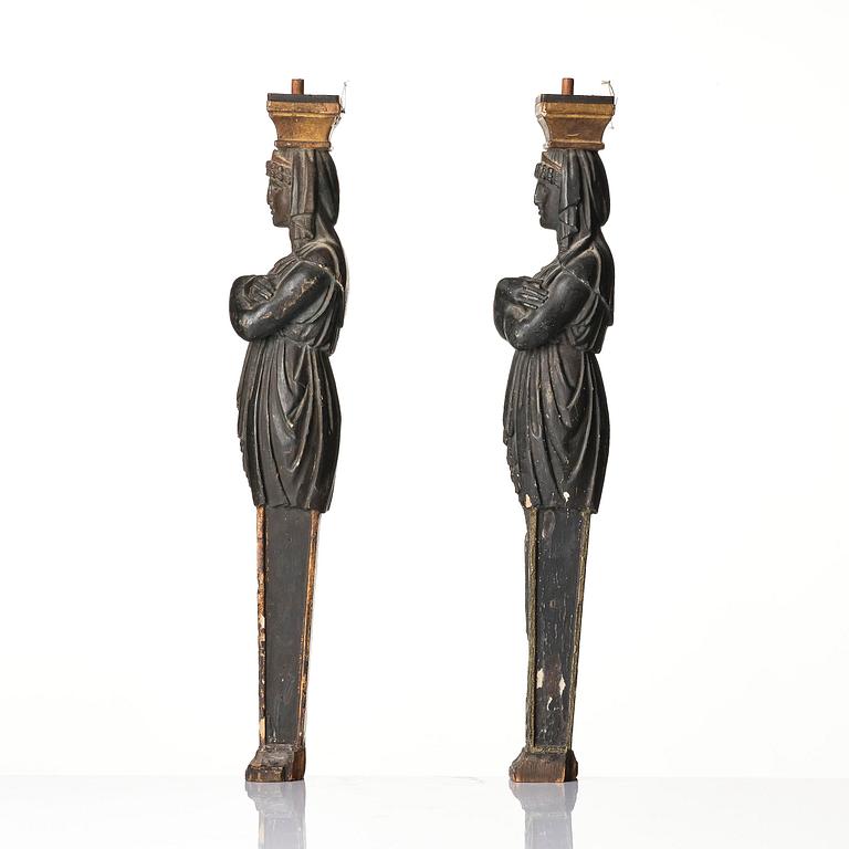 A pair of late Gustavian carved caryatids in the manner of Pehr Ljung (1743-1819) and Ernst Philip Thomann (1760-1833).