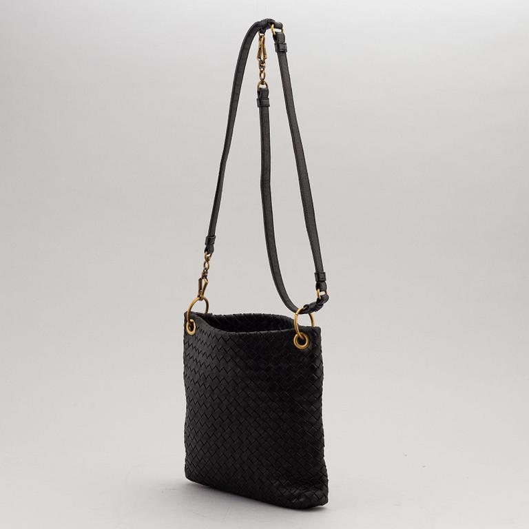 Bottega Veneta, a black intrecciato handbag.
