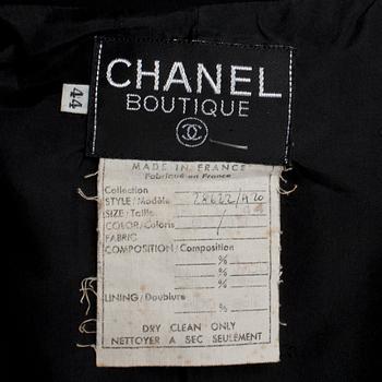 CHANEL, a black wool jacket/dress.