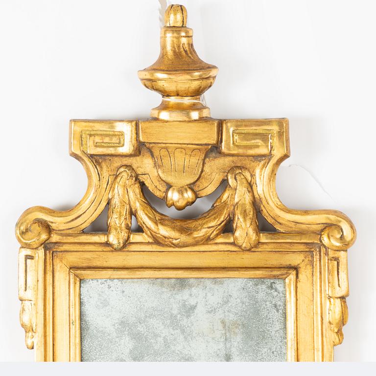 A Gustavian giltwood mirror by C. G. Fyrwald (master in Stockholm 1776-1825).