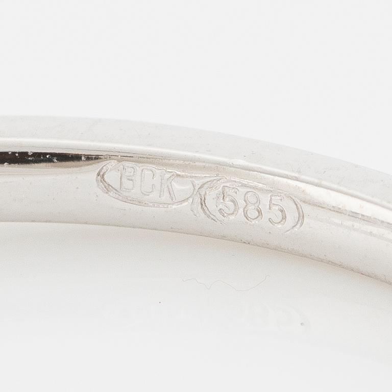 Ring 14K vitguld med orange safir och briljantslipade diamanter.