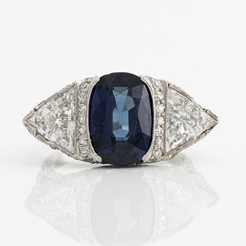 456A. A platinum ring set with a faceted sapphire.