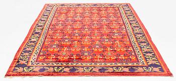An East Turkestan silk carpet, c. 308 x 182 cm.
