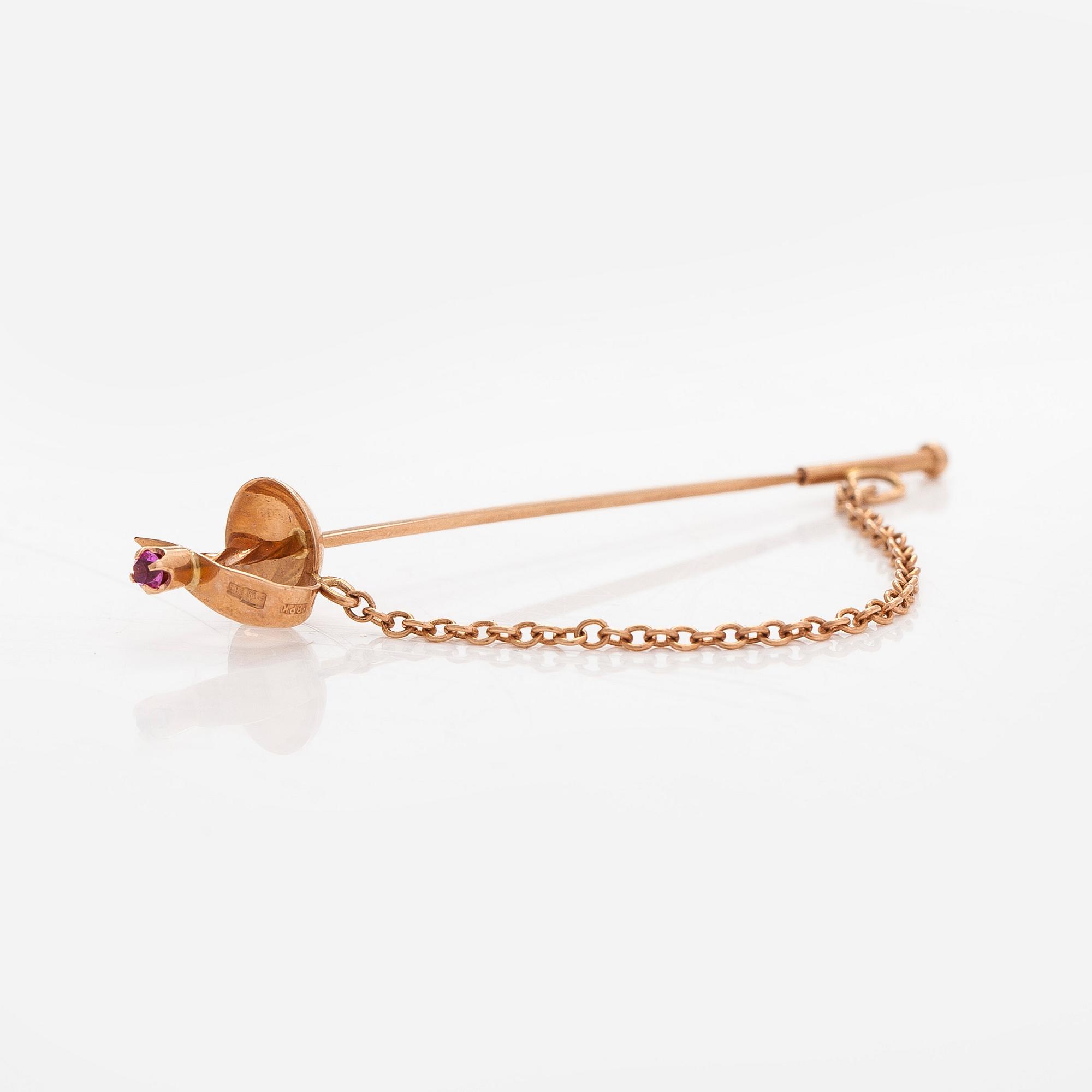 Tie pin, sword,  in 14K gold with a synthetic spinel. Soviet Union, late 20th century.