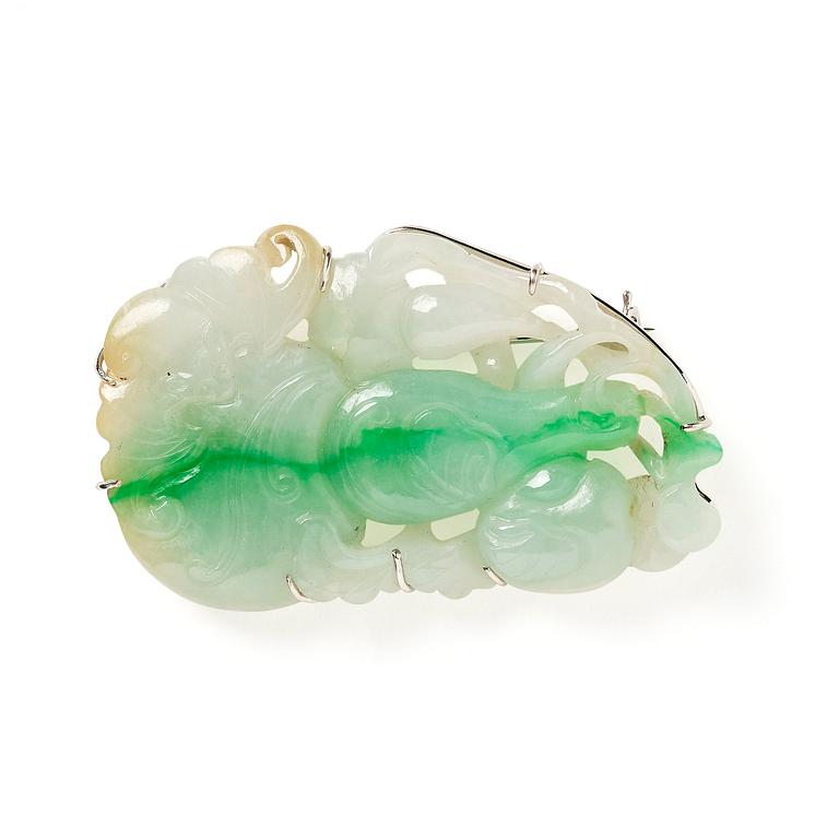 A Chinese jade pendant made in to a brooch, late Qing dynasty/early 20th century.