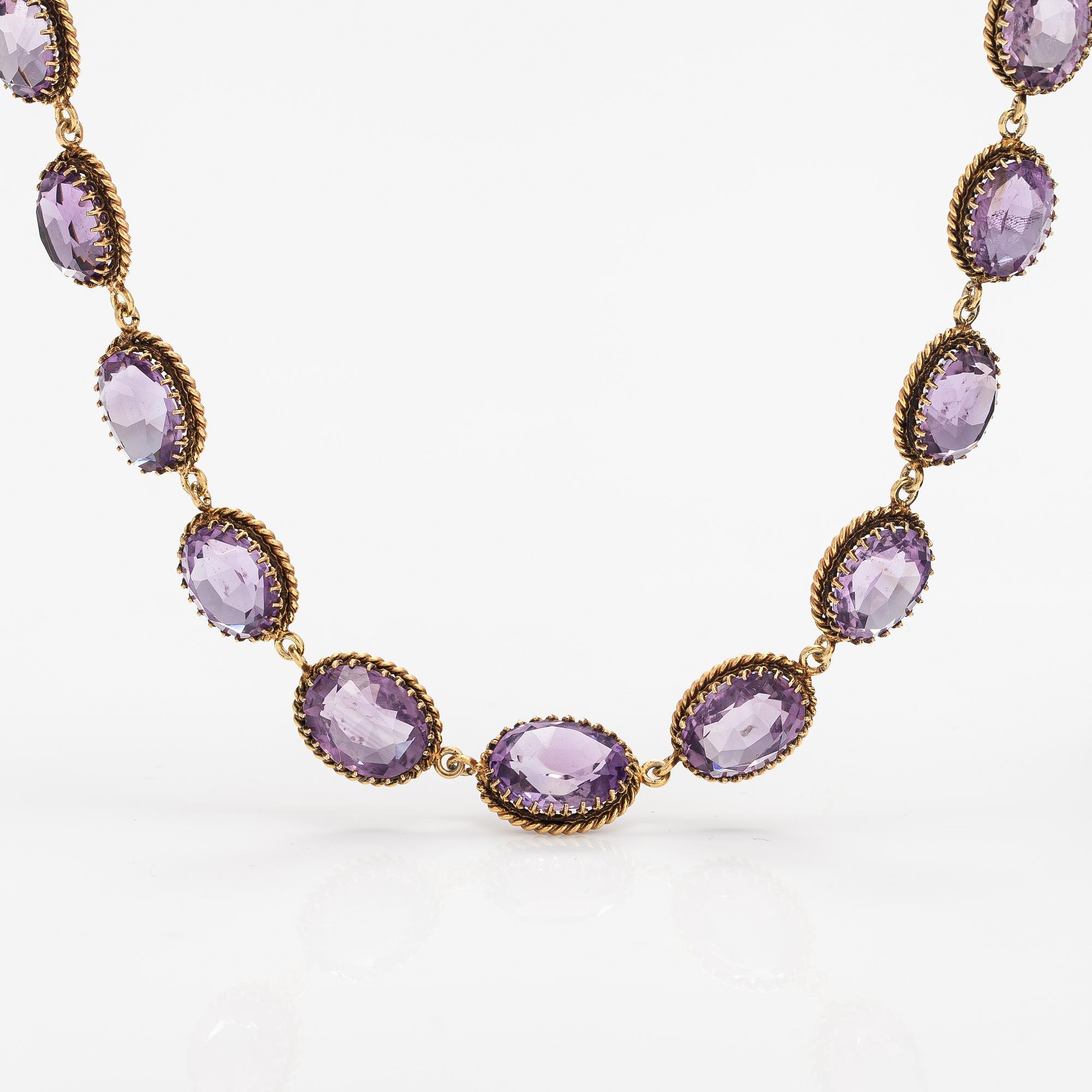 A necklace, bracelet and two brooches in gilded silver and with amethysts and pearls.