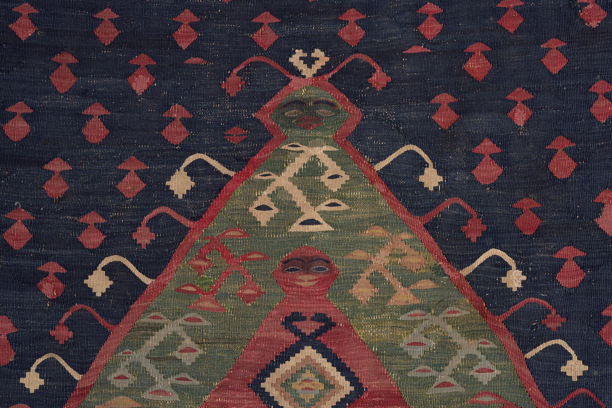 An antique Sarköy kelim, ca 239 x 214 cm.