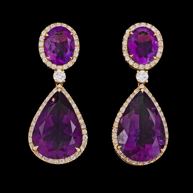 EARRINGS, oval and drop cut amethysts and brilliant cut diamonds, tot. 0.94 ct.