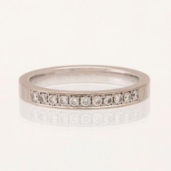 An 18K white gold half-eternity ring set with round brilliant-cut diamonds.