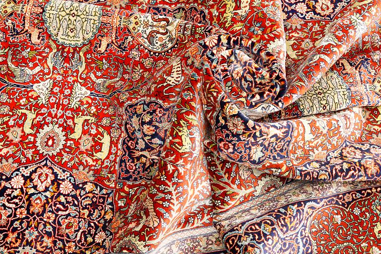 A pictoral orietal silk rug, 246 x 153 cm.