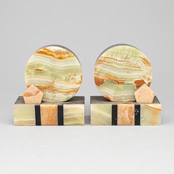 A pair of art déco onyx and marble book ends, 1930s.