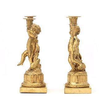 A pair of Louis XVI-style 19th century gilt bronze two-light candelabra.