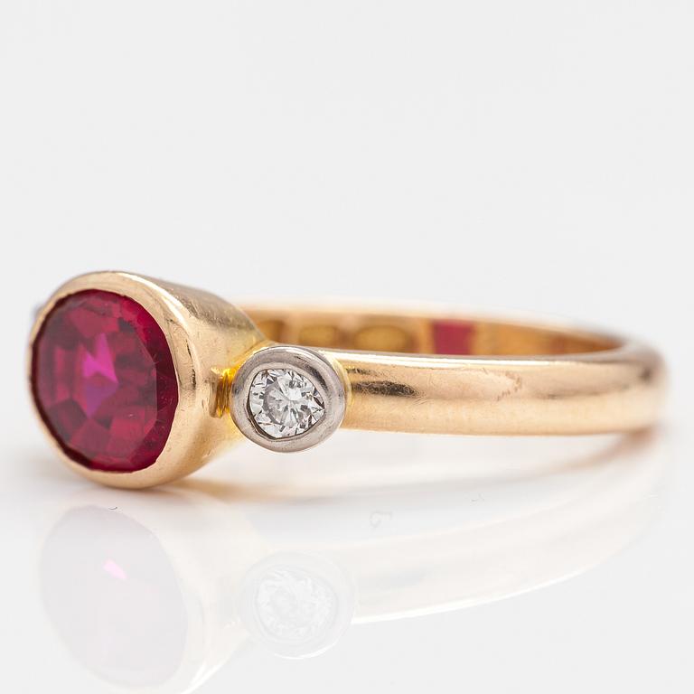 An 18K gold ring with a synthetic ruby and diamonds ca  0.22 ct in total. Lappi & K:ni, Lappeenranta 1925.