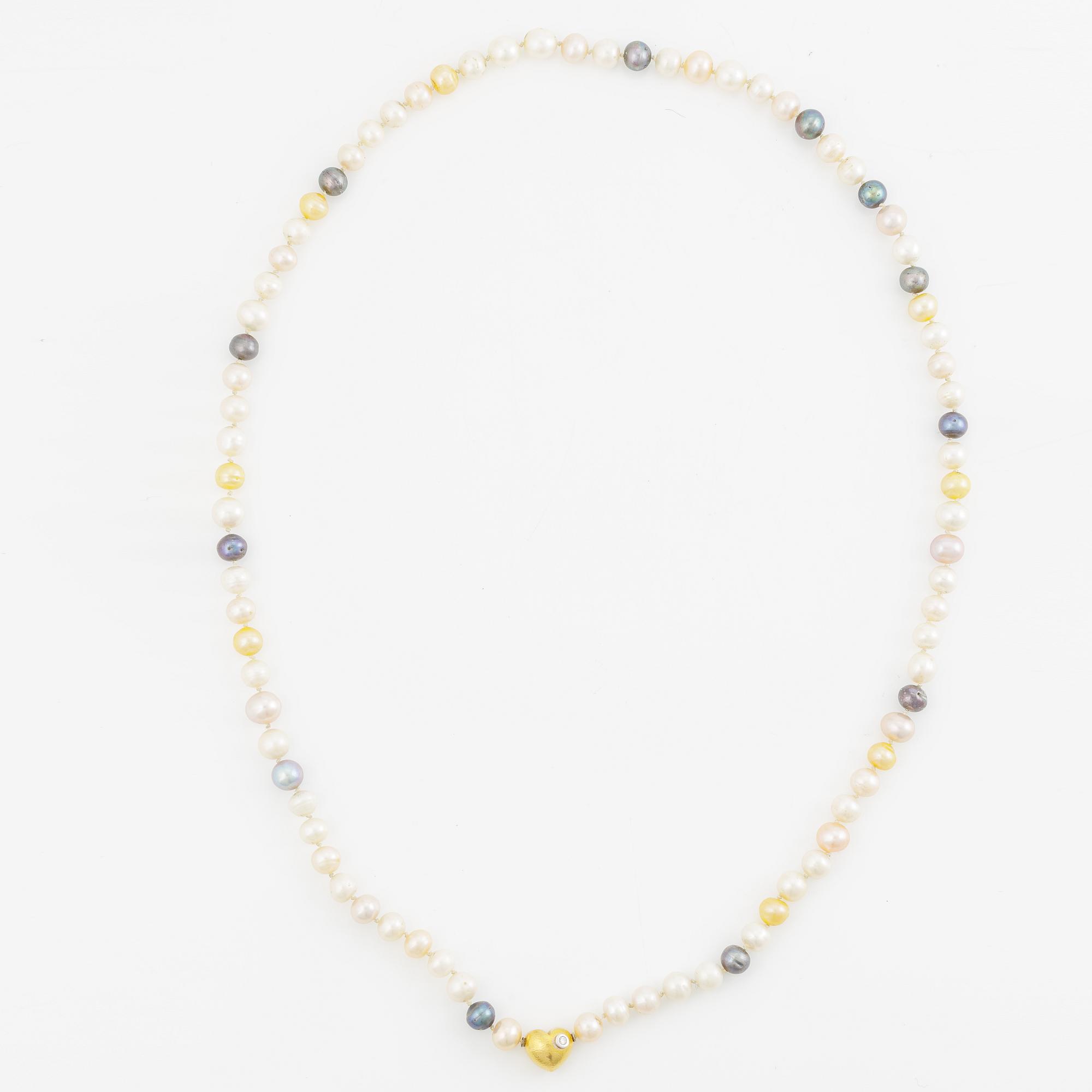 Ole Lynggaard clasp in 18K gold with a round brilliant-cut diamond and a necklace of cultured freshwater pearls.