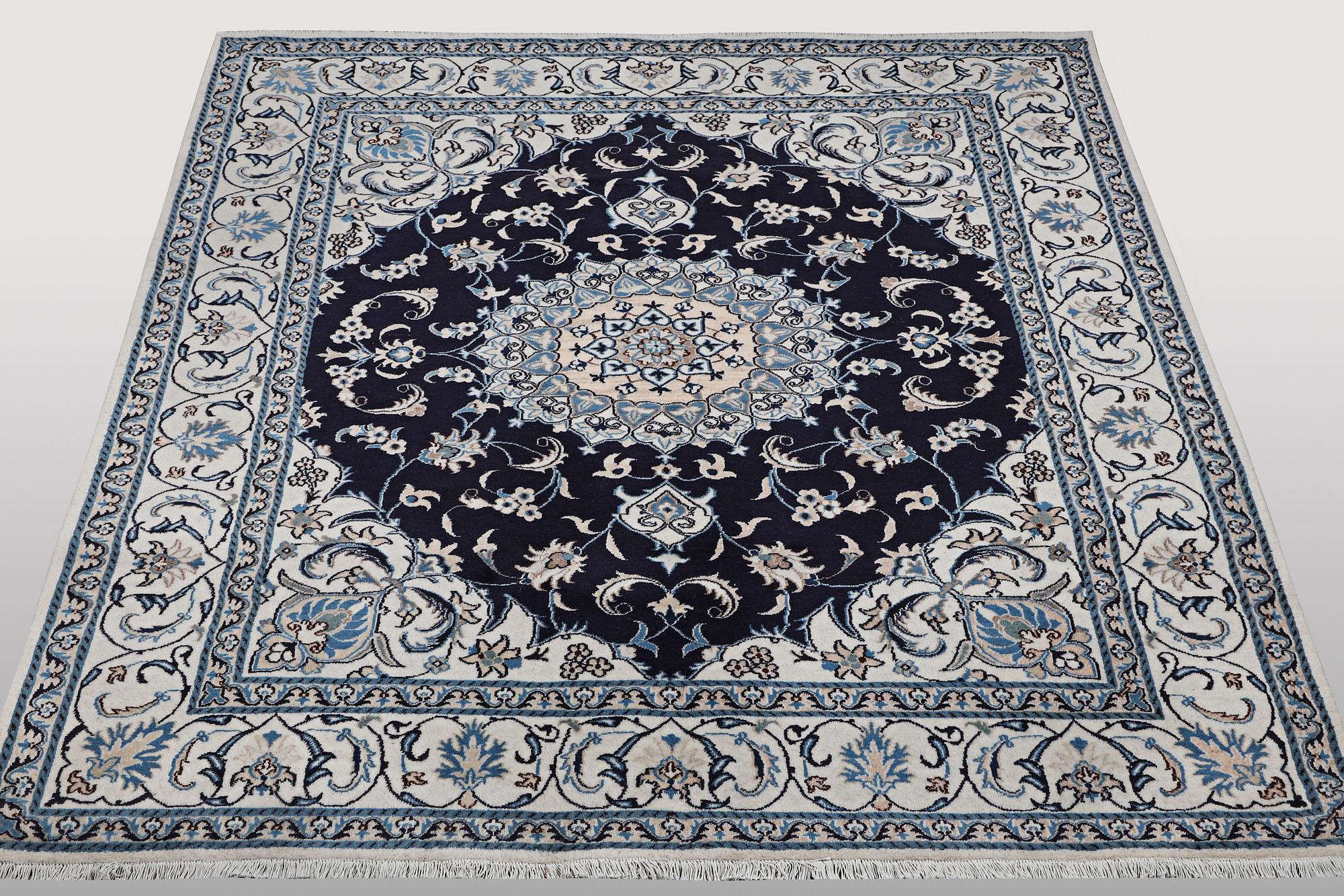 A carpet, Nain, part silk, ca 256 x 199 cm.