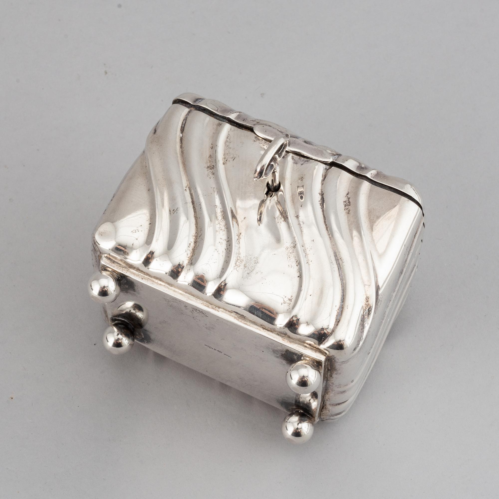 A 20th century parcel-gilt silver sugar-box, Swedish import marks from 1919.