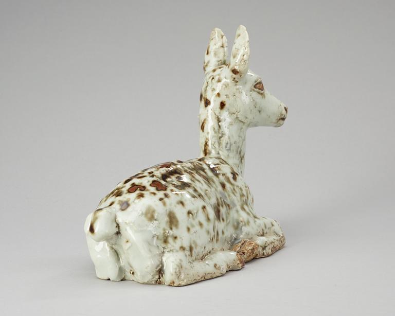 A Michael Schilkin stoneware sculpture of a deer, Arabia.