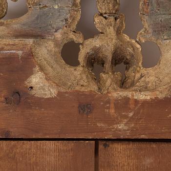 A Gustavian mirror by Nils Sundström dated 1774 .