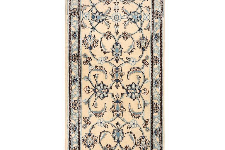 A Nain runner, part silk, c. 288 x 64 cm.